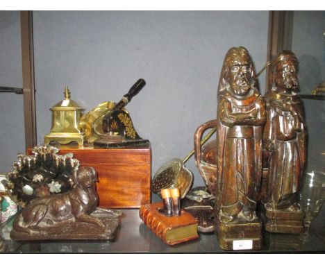 Pair of carved Medieval style eclesiastical figures; a mahogany two compartment tea caddy, brass chestnut toaster, brass coac