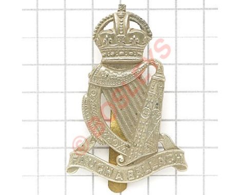 South African Irish Rifles cap badge.Die-stamped crowned harp resting on scroll inscribed “Faugh a Ballagh”.SliderVGC