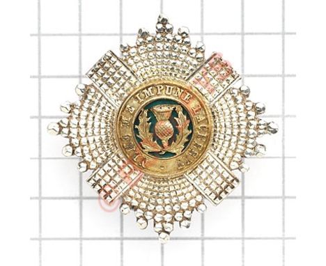 Scottish. Scots Guards silver Officer’s forage cap star.Silver, gilt and green translucent enamel. Reverse impressed “STERLIN
