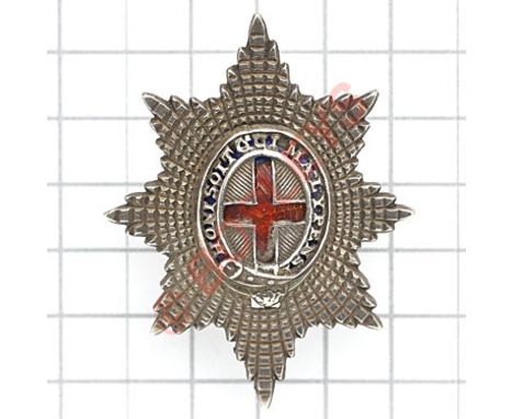 Coldstream Guards Officer’s 1984 Birmingham hallmarked silver forage cap badge.Die-cast facetted Garter Star mounted with pie