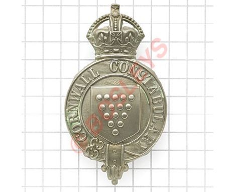 Cornwall Constabulary police helmet plate circa 1926-32.Scarce die-stamped white metal crowned title strap with central Arms 