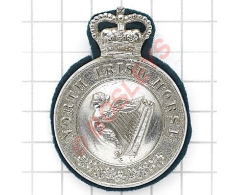 North Irish Horse EIIR NCO’s silver anodised arm badge.Die-cast crowned circlet “North Irish Horse” with shamrock spray to ba