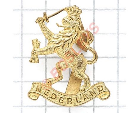“Free” Netherlands Army Officer’s cap badge. A good British made gilt example comprising the Royal Lion of the House of Orang