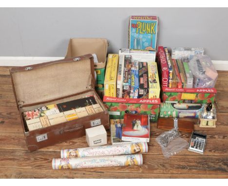 Four boxes of board games and collectables. Includes Commemorative souvenirs, craft materials, matchboxes, keys etc.