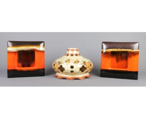 A vintage hand painted floral ceramic hanging lamp with a pair of multi-colour Fat Lava studio art pottery.