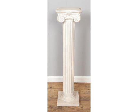 A composite ionic column torchere/plant stand. Approx. height 108cm.
