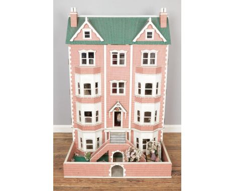A very large modern five storey dolls house with a good collection of furniture, dolls and accessories. Reverse is fully wire
