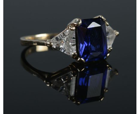 An Art Deco style 9ct gold synthetic sapphire and cubic zirconia dress ring. Size M. 3.97g.