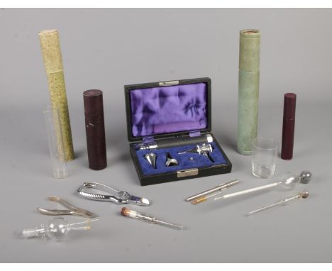 A collection of medical and scientific instruments, to include Gowlland auriscope, etched measuring tubes, Solingen pliers, T
