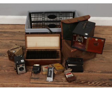 A collection of photographical equipment including a Mini Rex II, Kodak model B pocket camera, Houghton's Klito Falling Plate