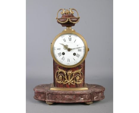 A Nineteenth Century French marble mantel clock. The white enamel dial featuring Roman Numeral markers and makers mark for Ra