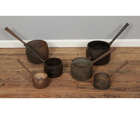 Six antique cast iron cooking pots