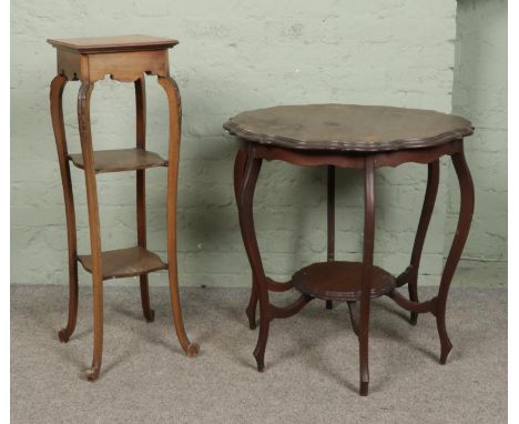 Two pieces of occasional furniture, consisting of mahogany window table of unusual form and three tier plant stand with carve