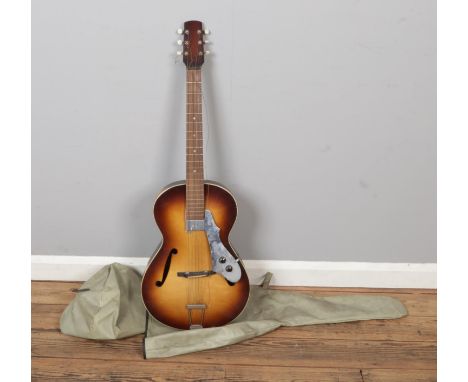 A Zenith acoustic guitar with travel bag