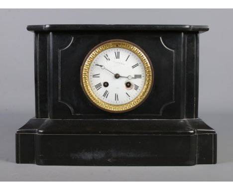 A Courtecuisse of Lille black slate mantel clock, featuring white enamel dial with Roman Numeral markers. The movement stampe
