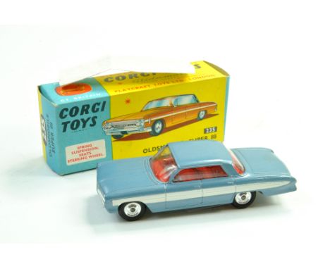 Corgi No. 235 Oldsmobile Super 88 with light blue body, white side flashes, red interior and spun hubs. Generally excellent i