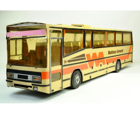 An approx 1/12 large scratch built model coach in the livery of Wallace Arnold. This unusual piece measures almost 1 metre in