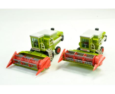 GAMA pair of 1/43 Combines comprising Claas Dominator 100 plus one other, scarce Volvo BM liveried issue. Generally Excellent