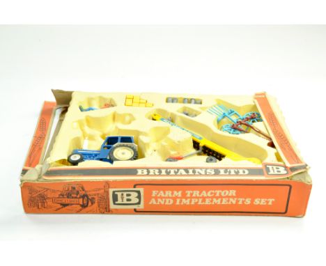 Britains Farm 1/32 Ford 5000 Tractor and Implement Set. Generally Excellent in Poor Box.