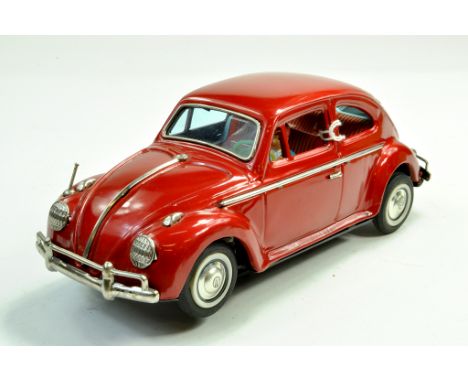 Bandai (Japan) Large Tinplate Battery Operated Model of an VW Sedan. Well preserved model is vibrant cherry metallic red. Gen
