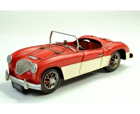 Large Tinplate Model of an Austin Healey in Red. Conceptual styling and displays well.