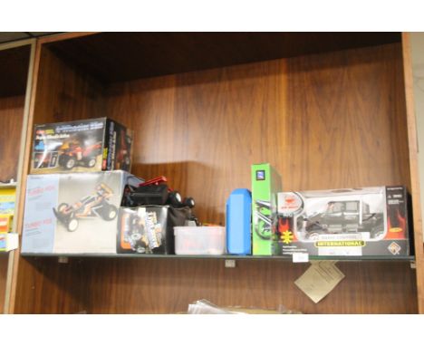 A SELECTION OF CARS AND TOYS TO INCLUDE RADIO CONTROL TRUCK, REMOTE CONTROL 4 WHEEL BIKE, MODEL KIT ETC