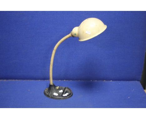 AN EARLY 20TH CENTURY ANGLE POISE DESK LAMP WITH CAST IRON BASE MARKED SUPREME 