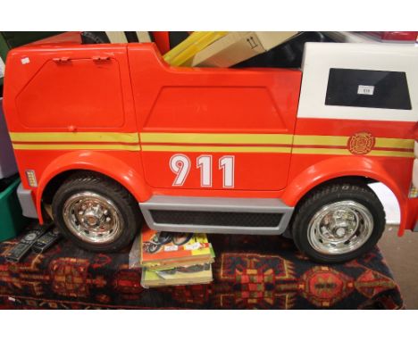 A CHILD'S BATTERY OPERATED FIRE ENGINE 