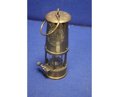 A BRASS ECCLES MINORS LAMP
