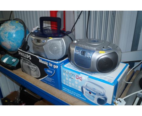 A Daewoo portable CD player with cassette recorder and a Philips CD sound machine