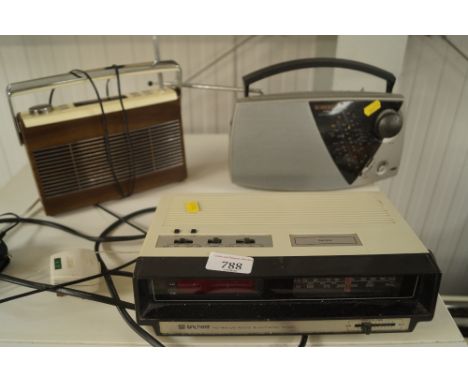 A Waltham radio alarm clock; a Roberts radio and a DAB radio