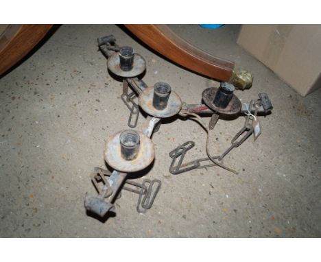 A metal hanging three branch light