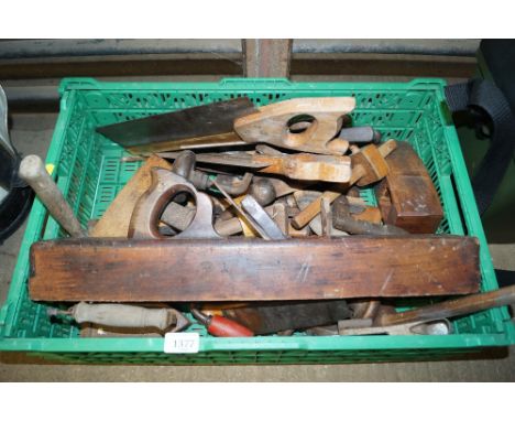 A box containing various tools to include planes, saws etc.