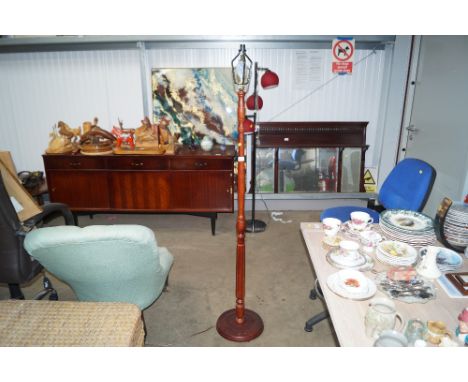A turned wooden standard lamp