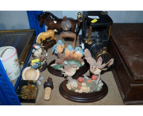 A collection of ornaments including a model vintage car; a Beswick horse; two Royal Doulton horses etc