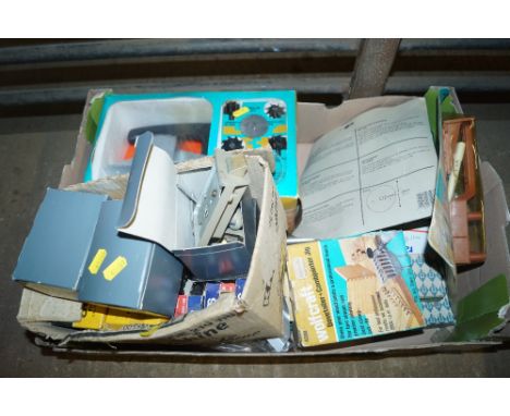 A box containing various tools to include Yale locks