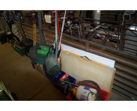 A drawing board, pasting table, various garden tools, petrol can etc.