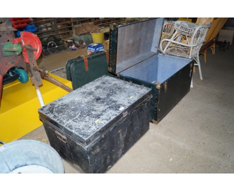 A travelling trunk together with metal storage trunk