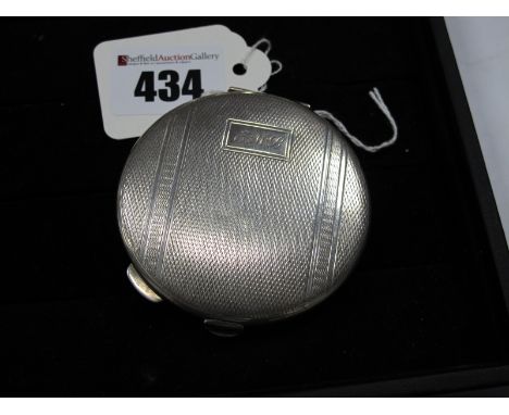 A Hallmarked Silver Ladies Compact Mirror, allover engine turned finish, initialled "E.M.B", 6.4cm diameter.