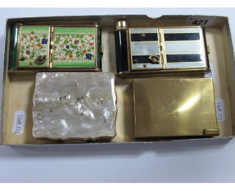 Two Vintage Musical Combination Powder Compact/Cigarette Cases, each with lipstick holder; together with a Stratton vintage m