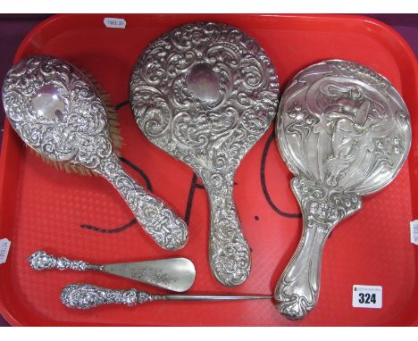 A Decorative Hallmarked Silver Backed Hair Brush, allover detailed in relief; together with a similar EPNS hand mirror, an Ar