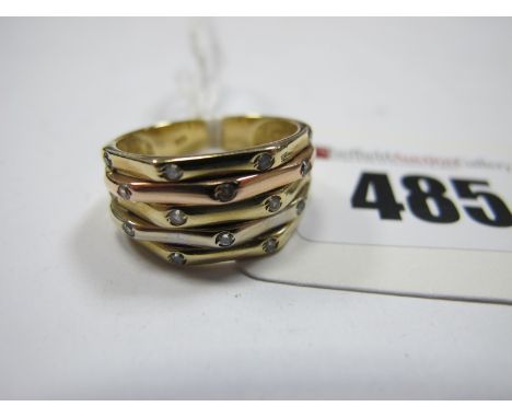 A Modern Three Colour Dress Ring, with inset highlights, stamped "585" (finger size P) (5g)