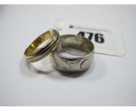A Modern 18ct Two Colour Gold Wedding Band, (finger size K) (3grams); together with a wide patterned band, indistinctly stamp