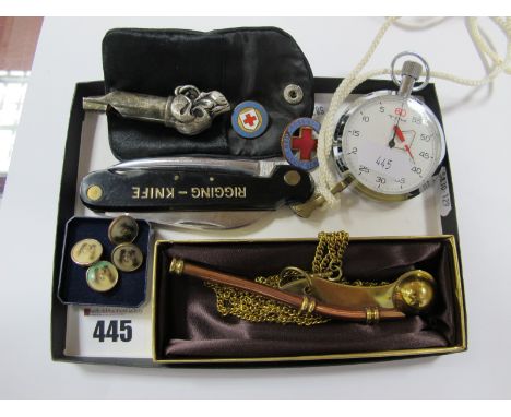 A Bosun Whistle, on chain, a rigging knife, a "Tim" Yachting Time, two enamel pins, a whistle with dog head finial, etc.