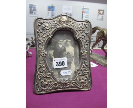 A Decorative Hallmarked silver Mounted Photograph Frame,  JG, Birmingham 1900, on easel back, overall height 17.5cm (damages)