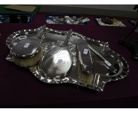 A Hallmarked Silver Backed Three Piece Dressing Table Set, (marks rubbed) engine turned and initialled, thre hairbrush handle