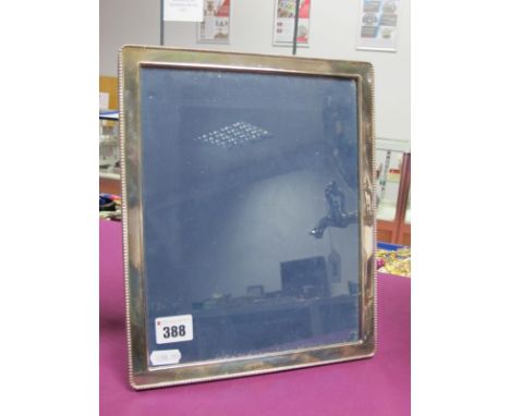 A Large Modern Hallmarked Silver Mounted Rectangular Photograph Frame, RC, Sheffield 1990, in navy blue plush easel back, ove