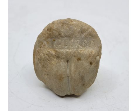 A 19th century sculpted white marble model of the female genitalia, inscribed "A Guerra" (To War), width 5cm.   Provenance: C