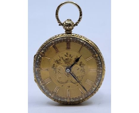 A Victorian 18ct. gold open face pocket watch, key wind, having engine turned and floral engraved gold Roman numeral dial wit