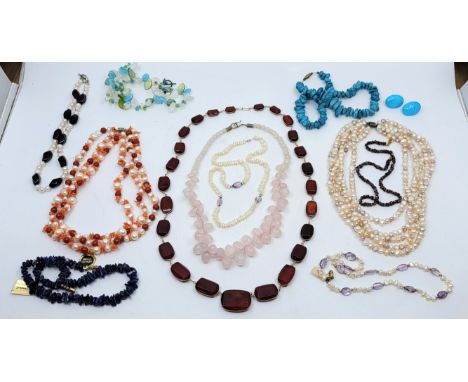 A four strand freshwater pearl necklace, together with a graduated rose quartz bead necklace, a graduated sherry amber bead n